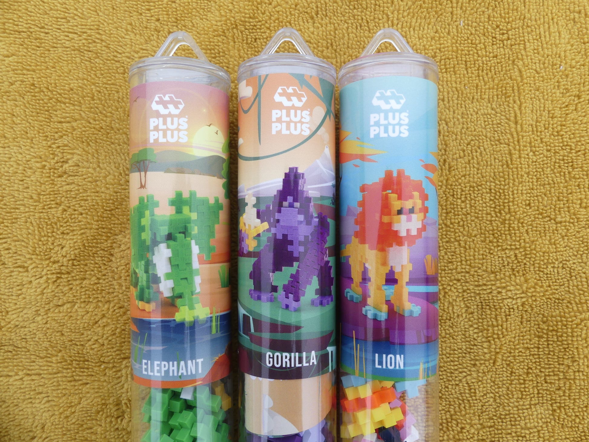 Lot de trois tubes puzzle Plus Plus: un lion, un gorille et un éléphant