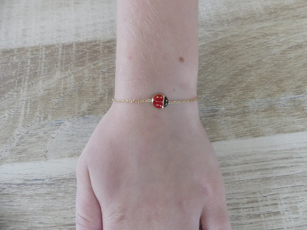 Bracelet enfant coccinelle émaillée – acier inoxydable doré