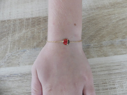 Bracelet enfant coccinelle émaillée – acier inoxydable doré