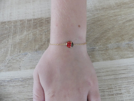Bracelet enfant coccinelle émaillée – acier inoxydable doré