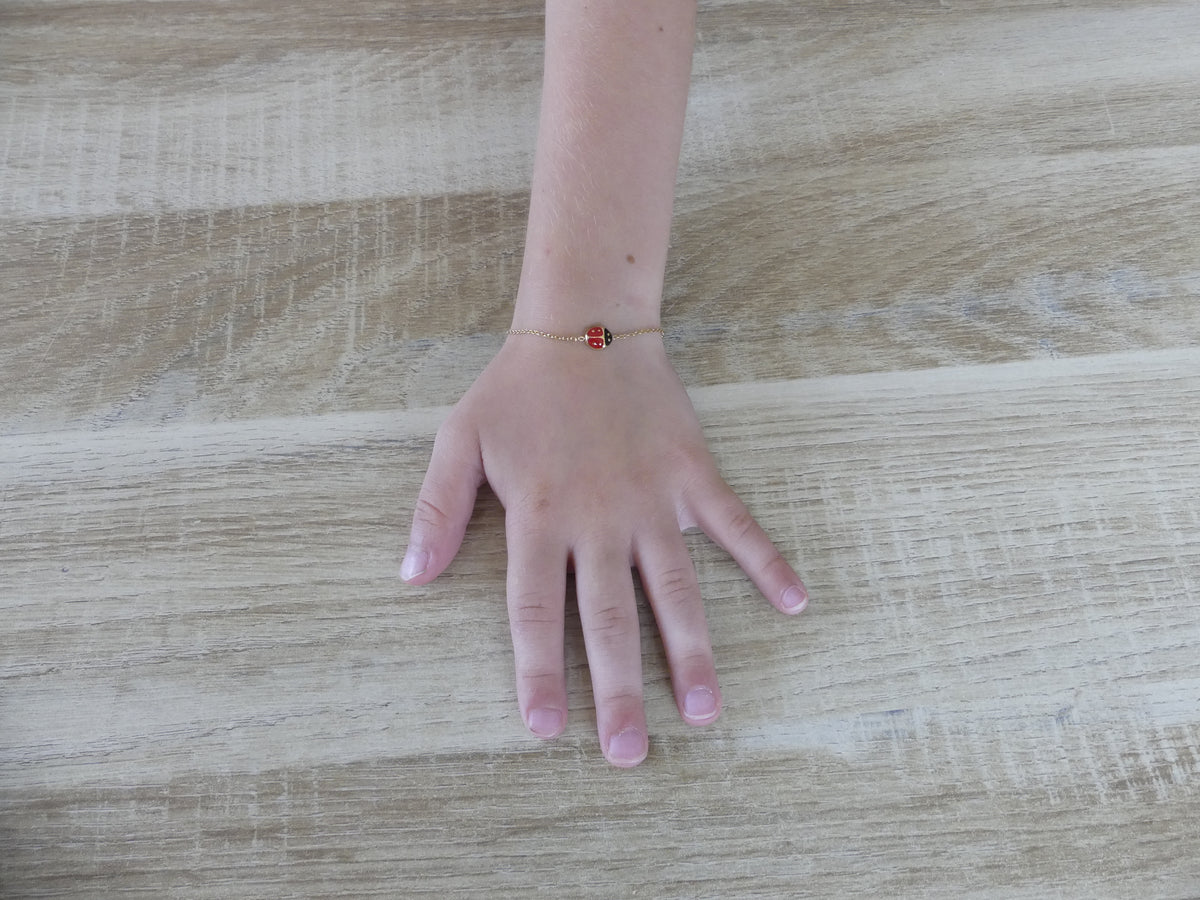 Bracelet enfant coccinelle émaillée – acier inoxydable doré