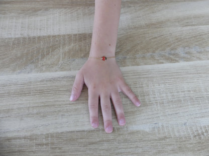 Bracelet enfant coccinelle émaillée – acier inoxydable doré