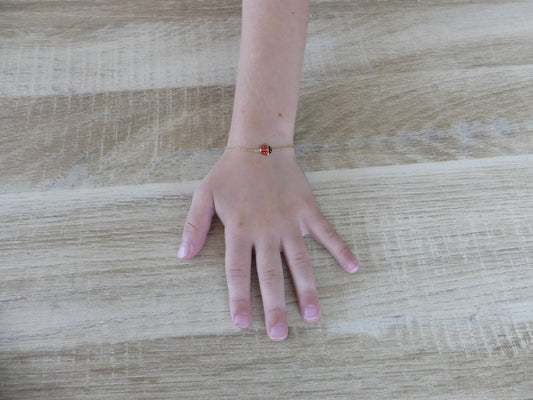 Bracelet enfant coccinelle émaillée – acier inoxydable doré