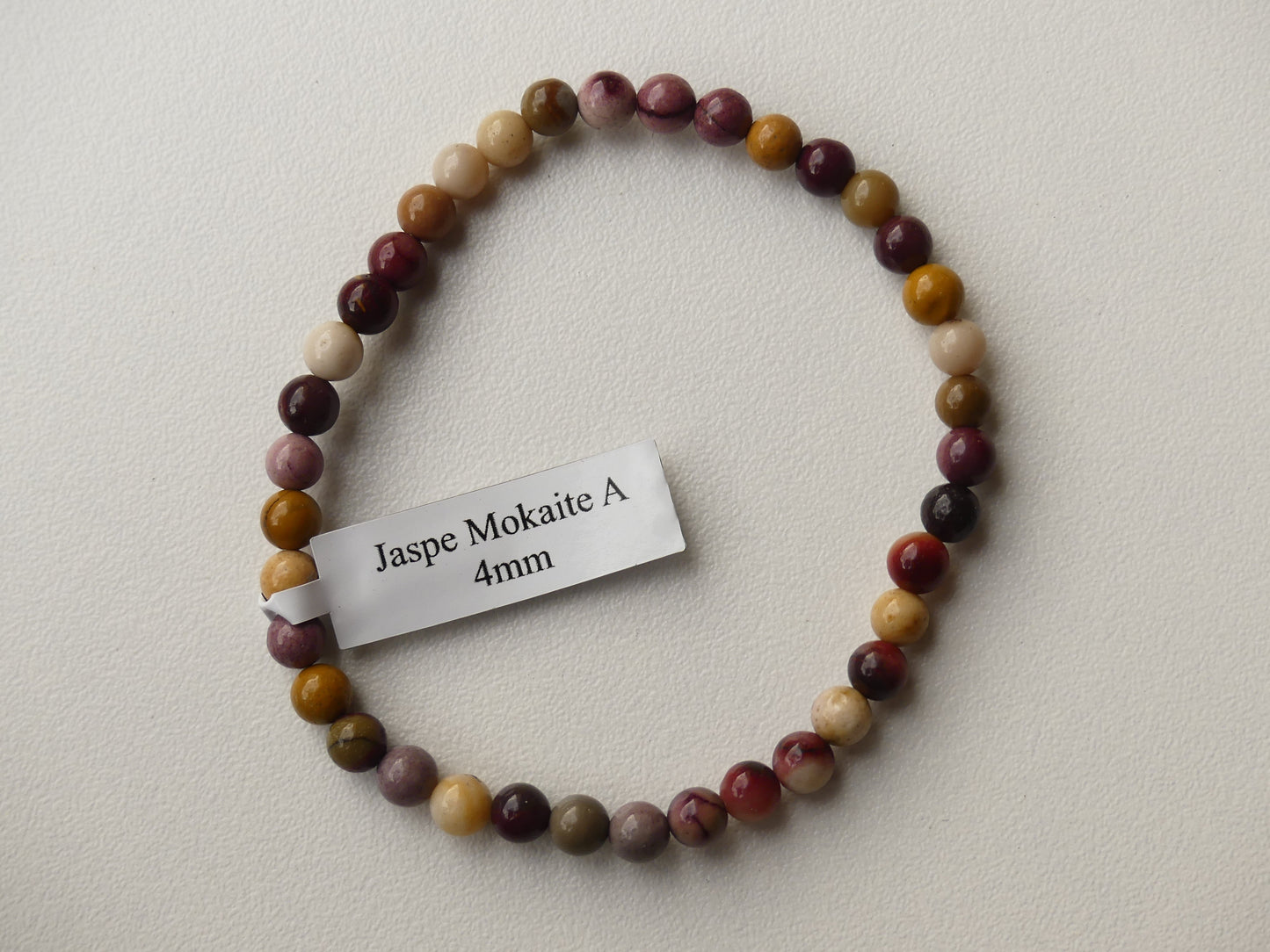 Bracelet boule diamètre 04mm en Jaspe Mokaite sur fil élastiqué.