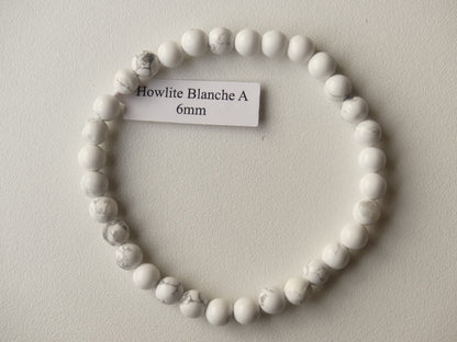 Bracelet boule de diamètre 6mm Howlite Blanche sur fil élastiqué. Pierre naturelle de qualité A.