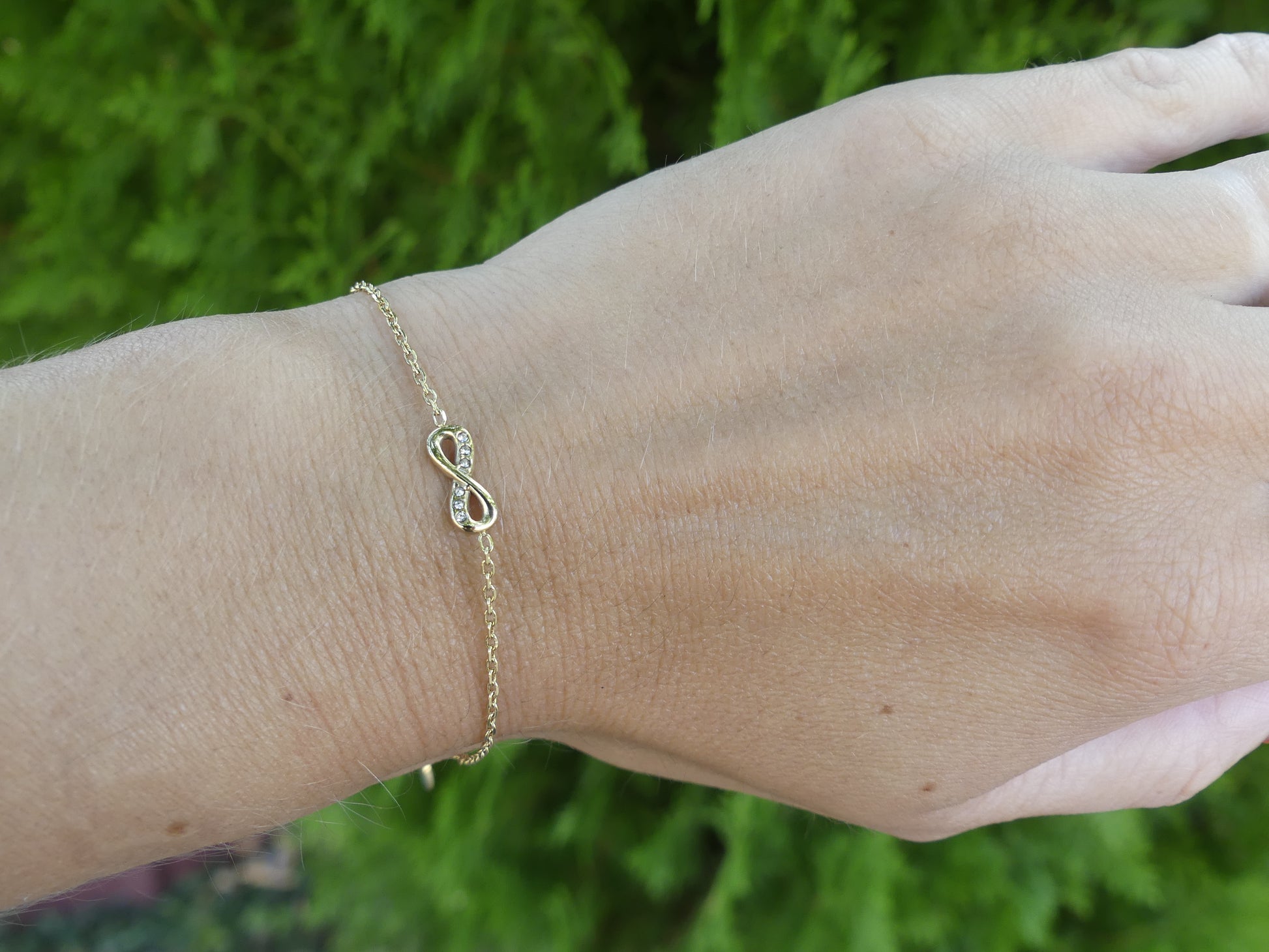 bracelet pendentif infini doré