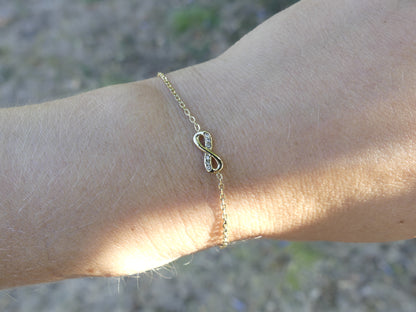 bracelet pendentif infini doré
